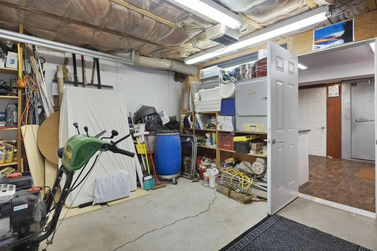 Garage with stored household items and tools